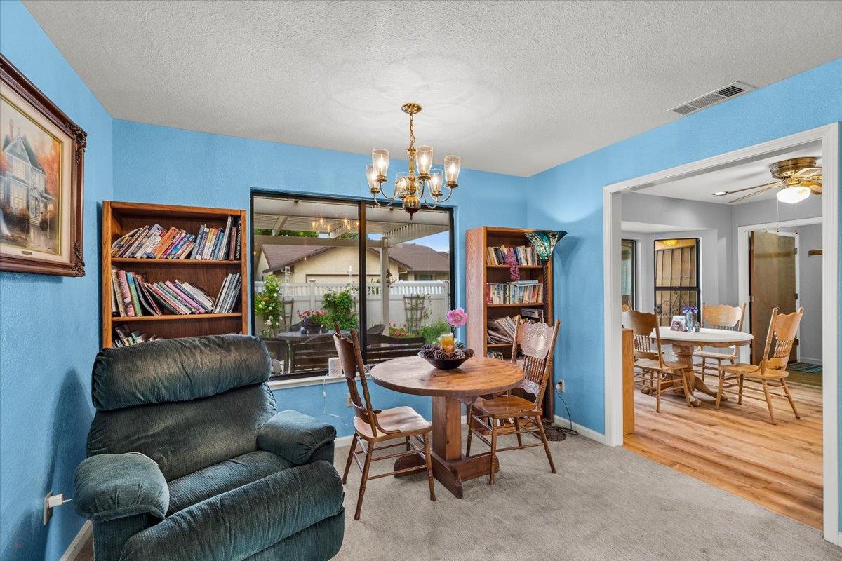 2136 Candy Cane Walk Manteca, CA 95336 - Photo 15 of 60 a living room with furniture and a large window