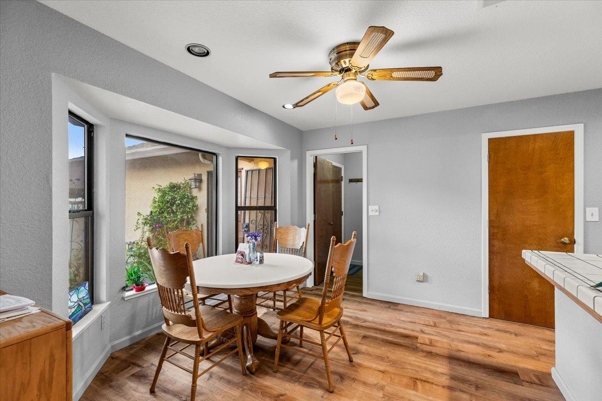 2136 Candy Cane Walk Manteca, CA 95336 - Photo 16 of 60 a view of a dining room with furniture and window