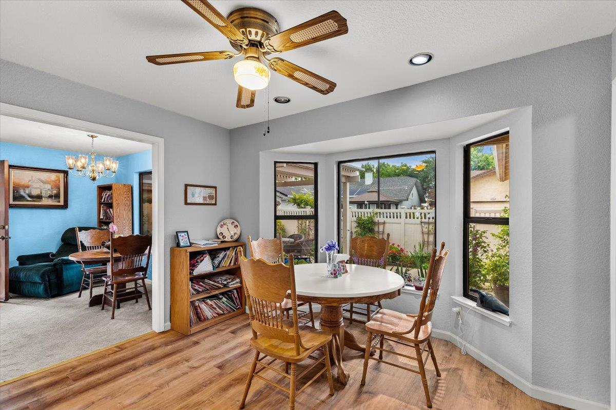 2136 Candy Cane Walk Manteca, CA 95336 - Photo 17 of 60 a view of a dining room with furniture window and outside view