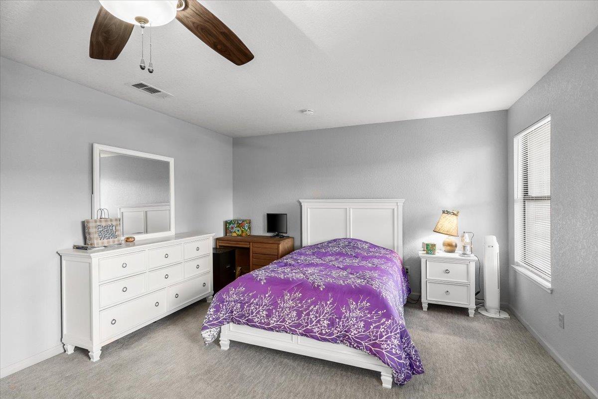 2136 Candy Cane Walk Manteca, CA 95336 - Photo 31 of 60 a bedroom with a bed and a closet