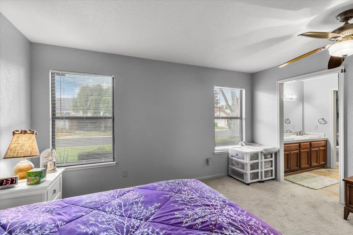 2136 Candy Cane Walk Manteca, CA 95336 - Photo 32 of 60 a bedroom with a bed and a window