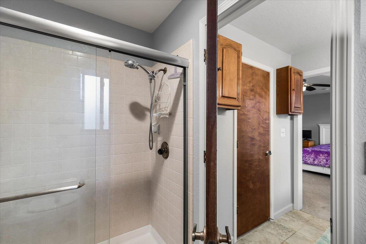 2136 Candy Cane Walk Manteca, CA 95336 - Photo 34 of 60 a bathroom with a shower