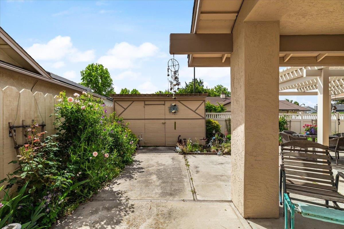 2136 Candy Cane Walk Manteca, CA 95336 - Photo 37 of 60 a view of a street with potted plants