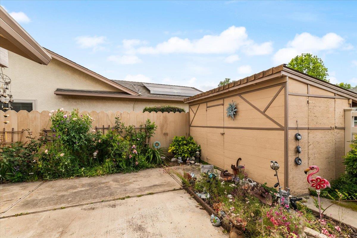 2136 Candy Cane Walk Manteca, CA 95336 - Photo 44 of 60 view of side of property featuring stucco siding and a patio