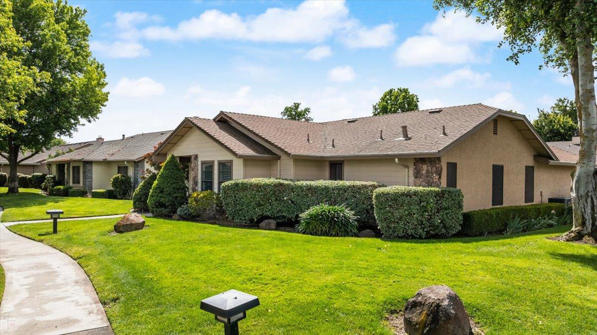 2136 Candy Cane Walk Manteca, CA 95336 - Photo 5 of 60 a front view of a house with a yard
