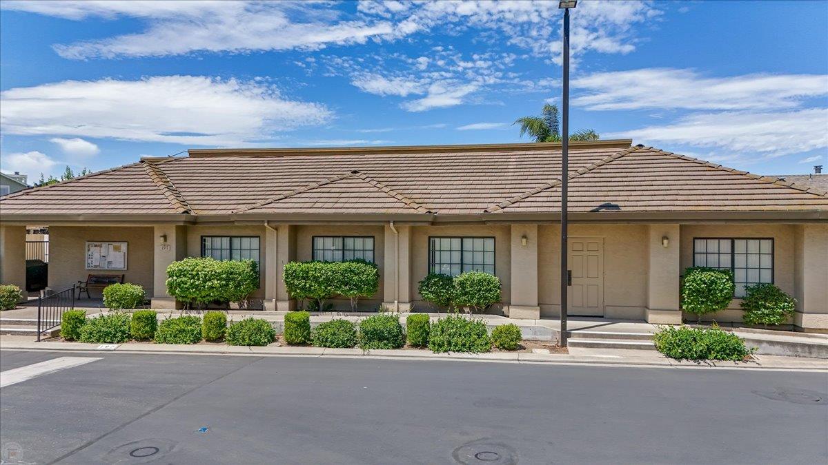 2136 Candy Cane Walk Manteca, CA 95336 - Photo 53 of 60 a front view of a building with garden