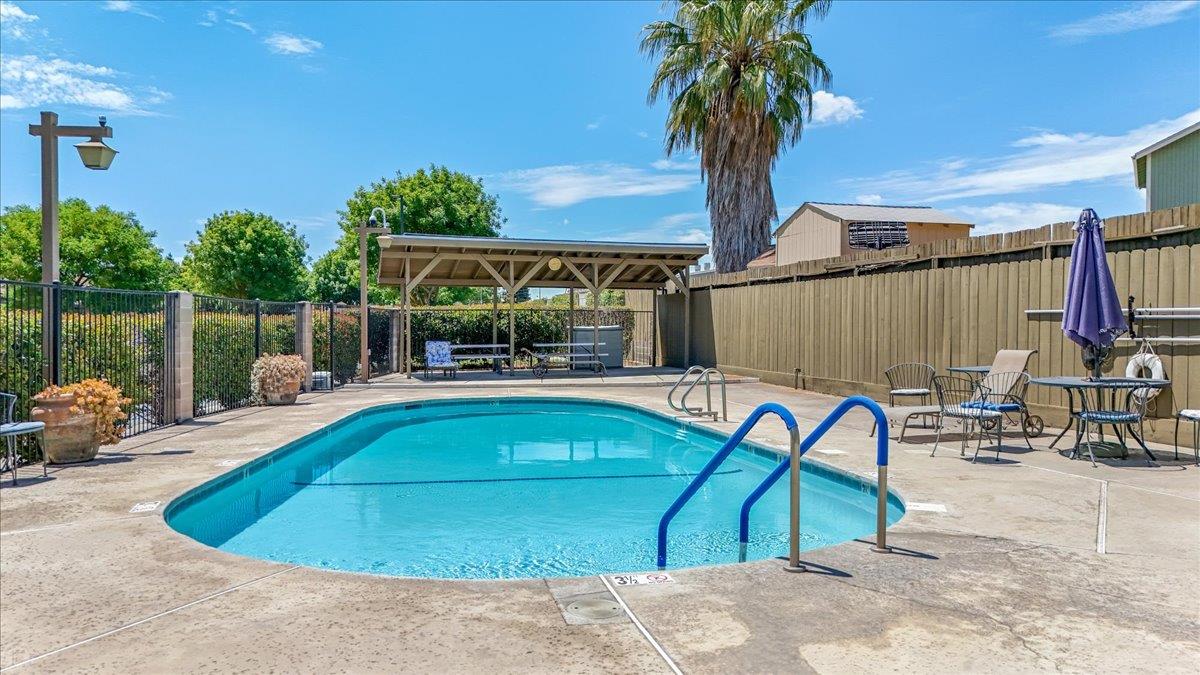 2136 Candy Cane Walk Manteca, CA 95336 - Photo 56 of 60 a view of swimming pool with outdoor seating and a patio