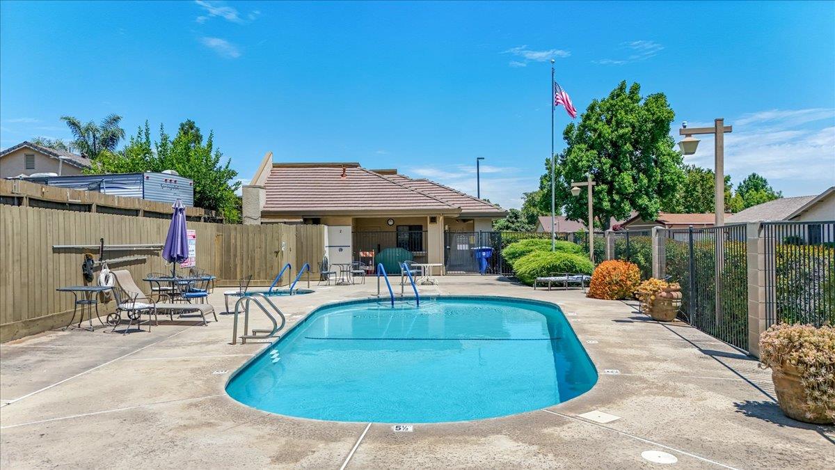 2136 Candy Cane Walk Manteca, CA 95336 - Photo 58 of 60 a view of a house with swimming pool and sitting area
