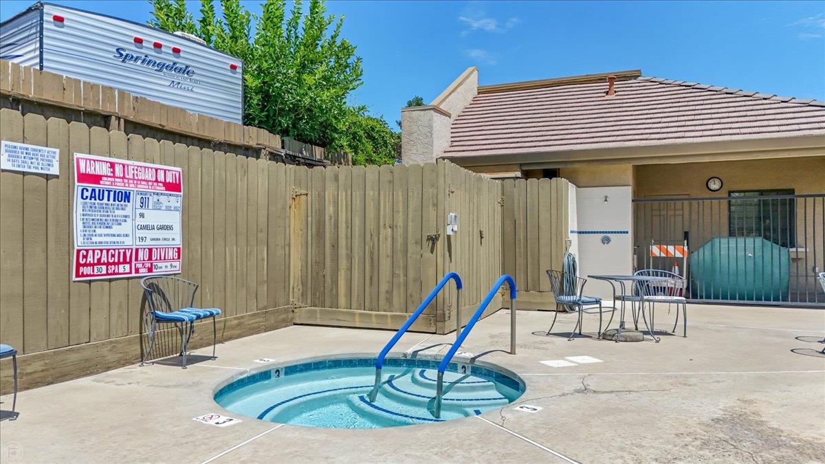2136 Candy Cane Walk Manteca, CA 95336 - Photo 59 of 60 view of swimming pool featuring a community hot tub and patio surround