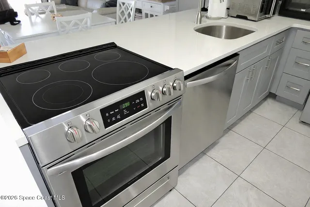 a white refrigerator freezer sitting in a kitchen