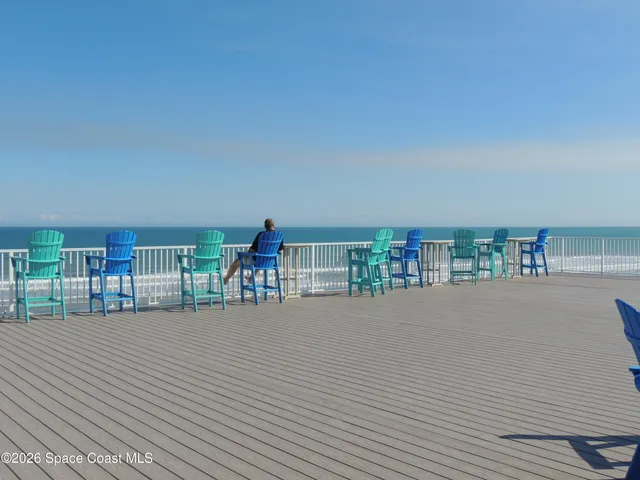 a view of a swimming pool with an outdoor seating