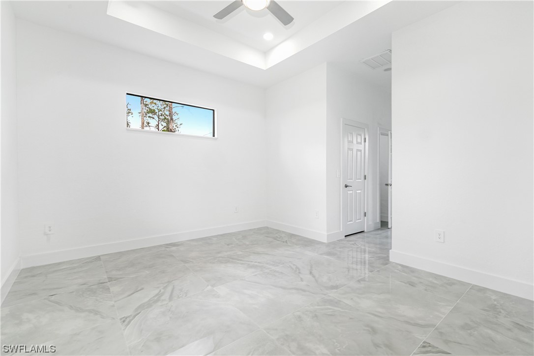 1119 Colonial Street East Lehigh Acres, FL 33974 - Photo 13 of 17 an empty room with windows