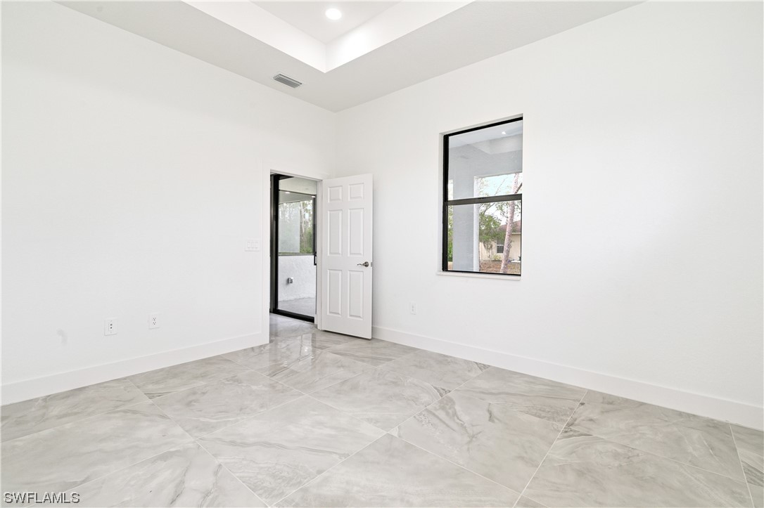 1119 Colonial Street East Lehigh Acres, FL 33974 - Photo 14 of 17 an empty room with windows and closet