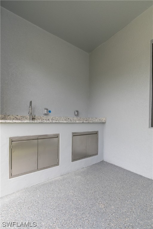 1119 Colonial Street East Lehigh Acres, FL 33974 - Photo 17 of 17 a view of a kitchen with a sink and a stove