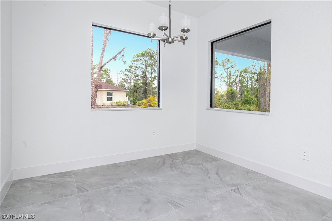 1119 Colonial Street East Lehigh Acres, FL 33974 - Photo 10 of 17 an empty room with a window