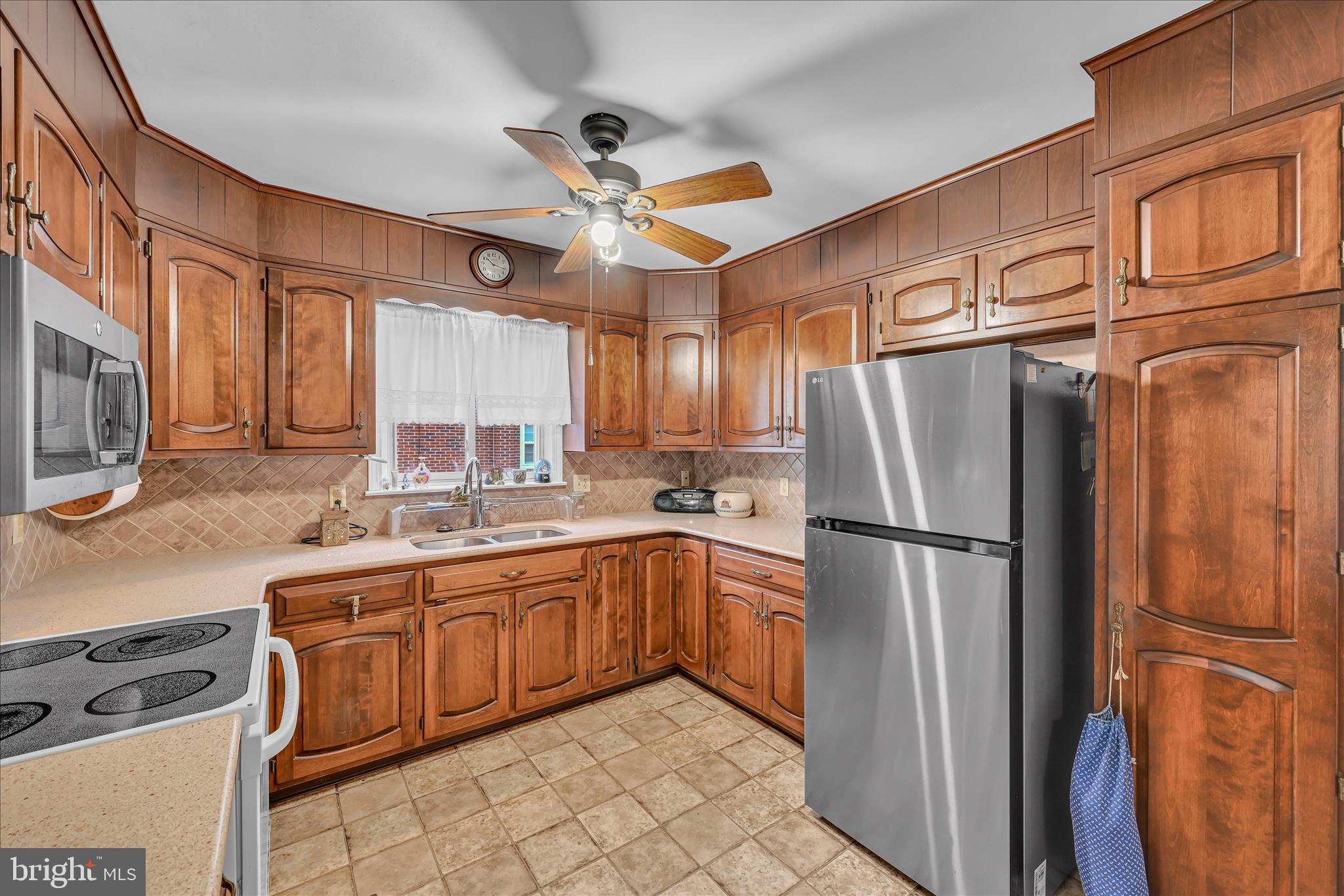 4012 Kutztown Road Temple, PA 19560 - Photo 11 of 30 a kitchen with stainless steel appliances granite countertop a refrigerator a stove top oven a sink and dishwasher