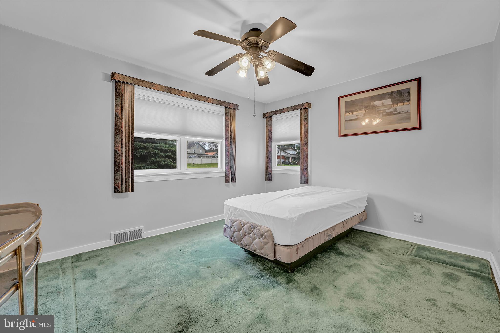 4012 Kutztown Road Temple, PA 19560 - Photo 13 of 30 a bedroom with a bed and a chandelier
