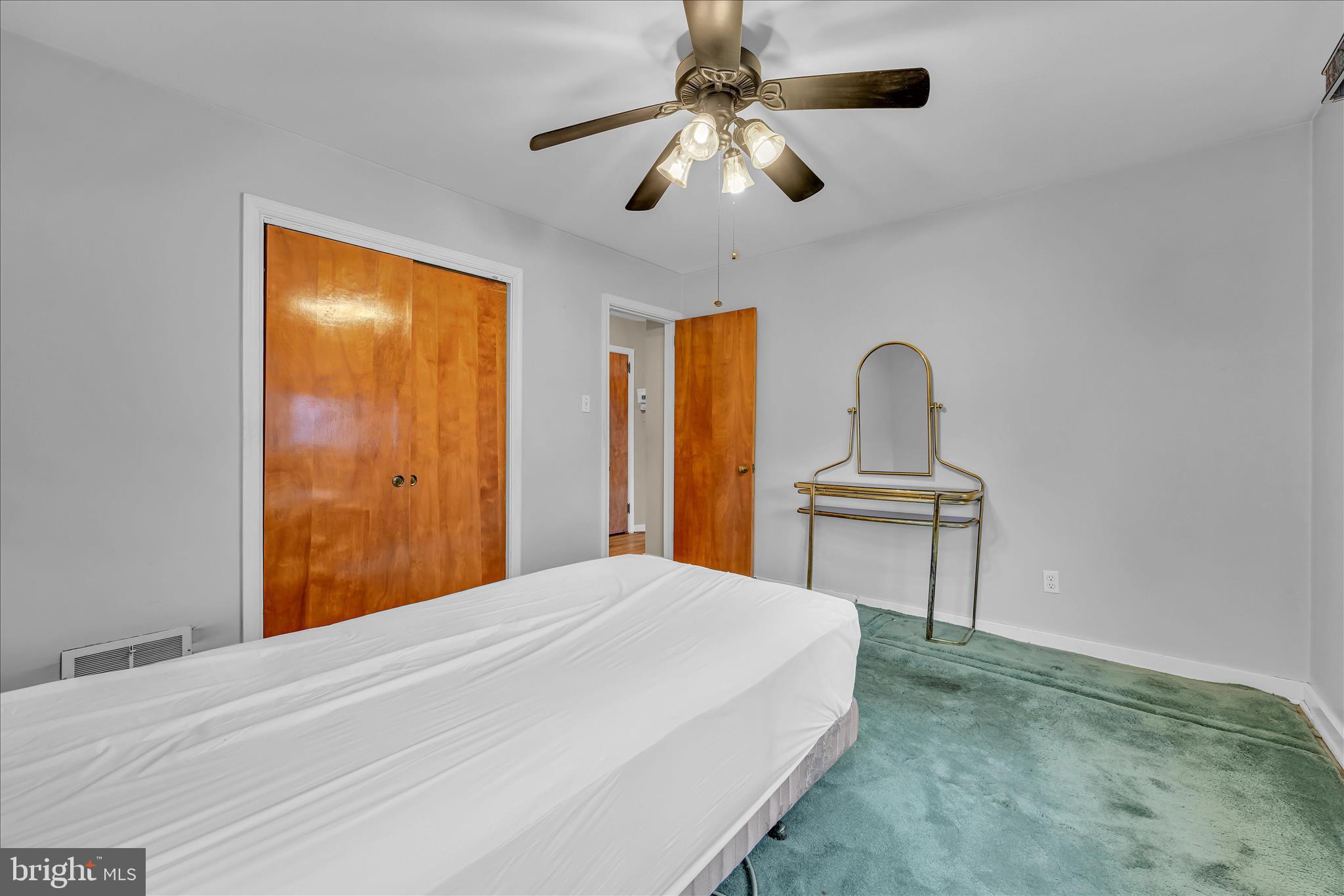 4012 Kutztown Road Temple, PA 19560 - Photo 14 of 30 a bedroom with a bed and a chandelier