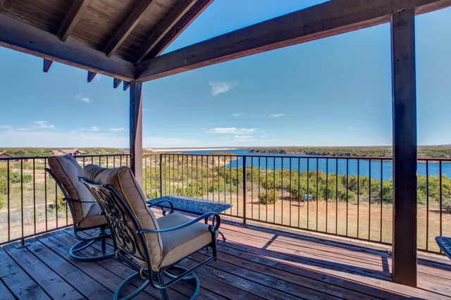a view of a patio with couches and table and chairs