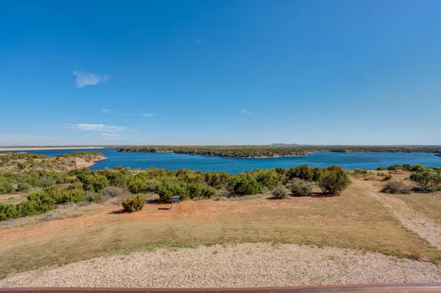 a view of a livingroom with furniture and a fireplace