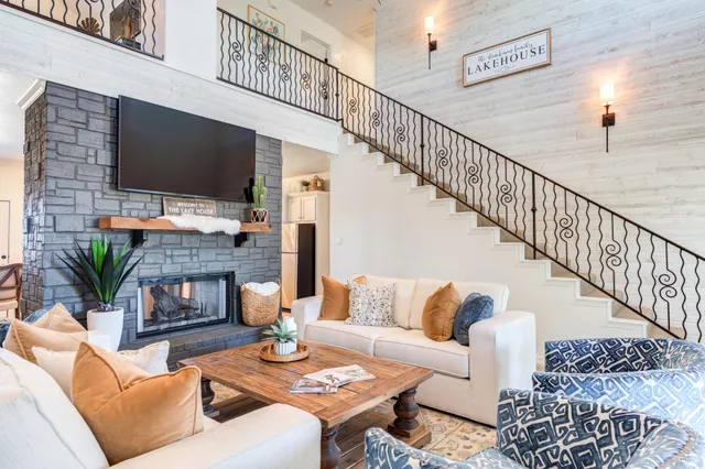 a living room with furniture and a large window