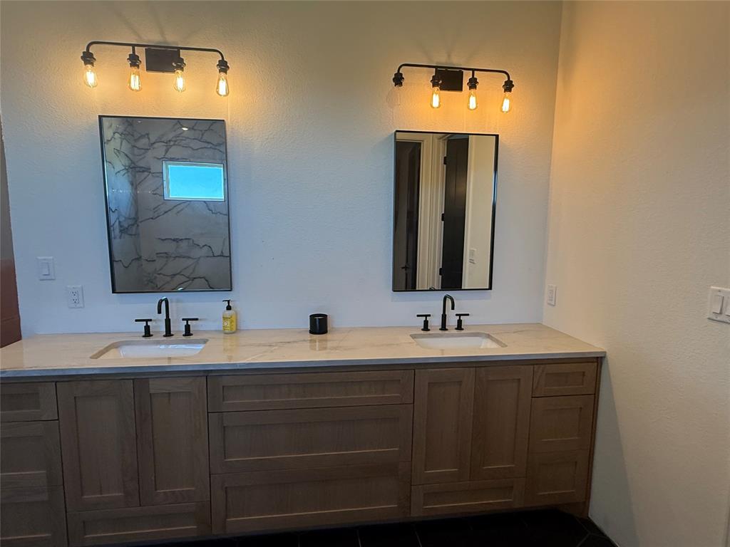 2798 Mockingbird Lane Moody, TX 76557 - Photo 16 of 35 a bathroom with a double vanity sink and a mirror