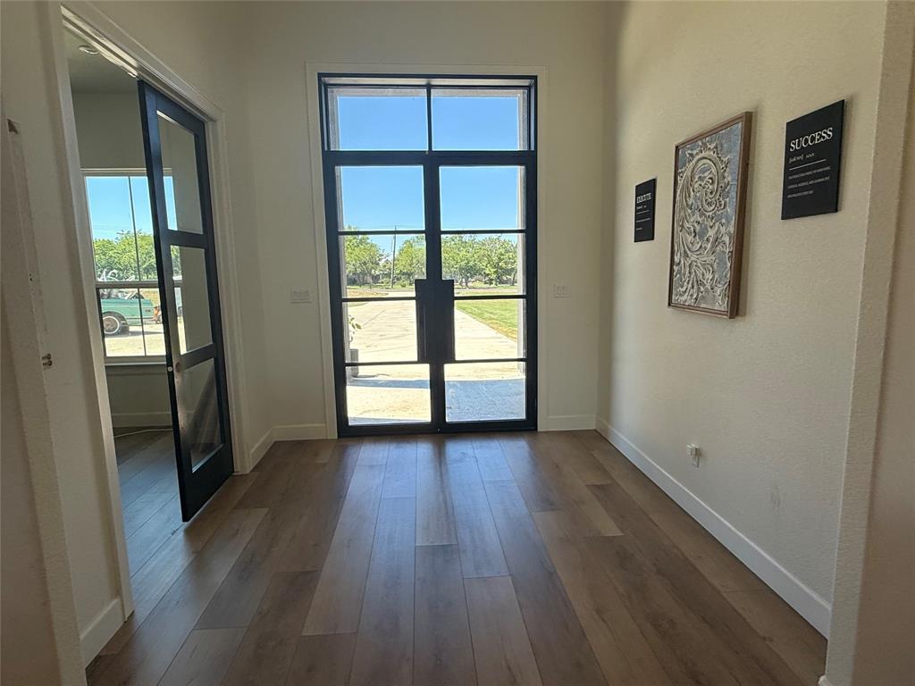 2798 Mockingbird Lane Moody, TX 76557 - Photo 19 of 35 an empty room with wooden floor and windows