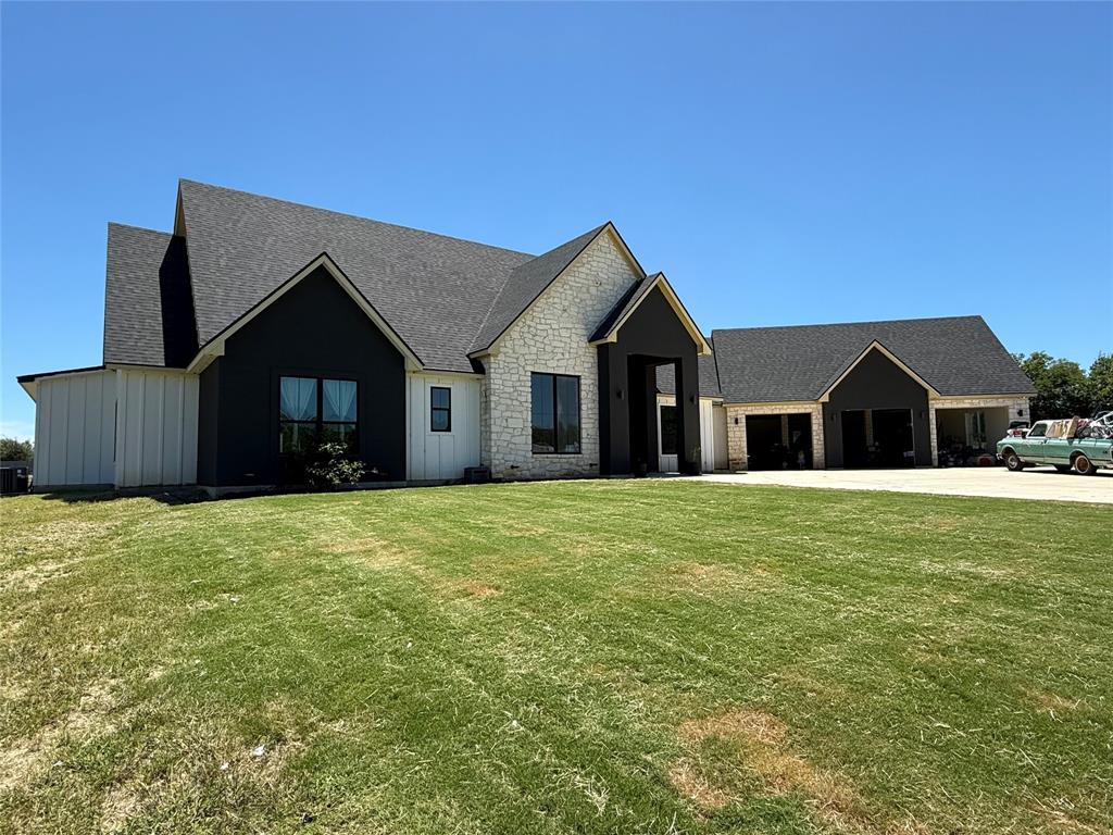 2798 Mockingbird Lane Moody, TX 76557 - Photo 2 of 35 a front view of a house with a garden