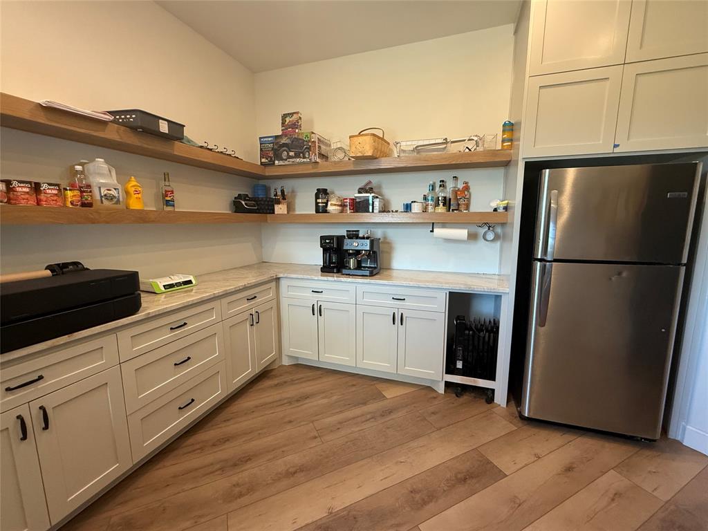 2798 Mockingbird Lane Moody, TX 76557 - Photo 23 of 35 a kitchen with stainless steel appliances a refrigerator stove and sink