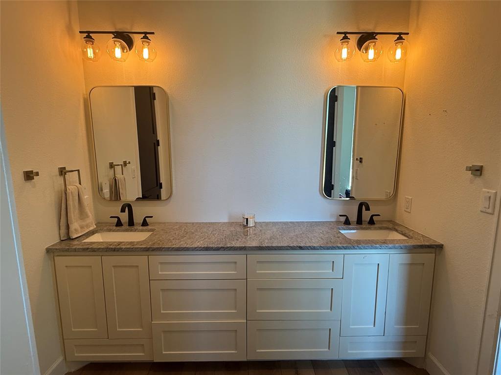 2798 Mockingbird Lane Moody, TX 76557 - Photo 10 of 35 a bathroom with a double vanity sink and a mirror