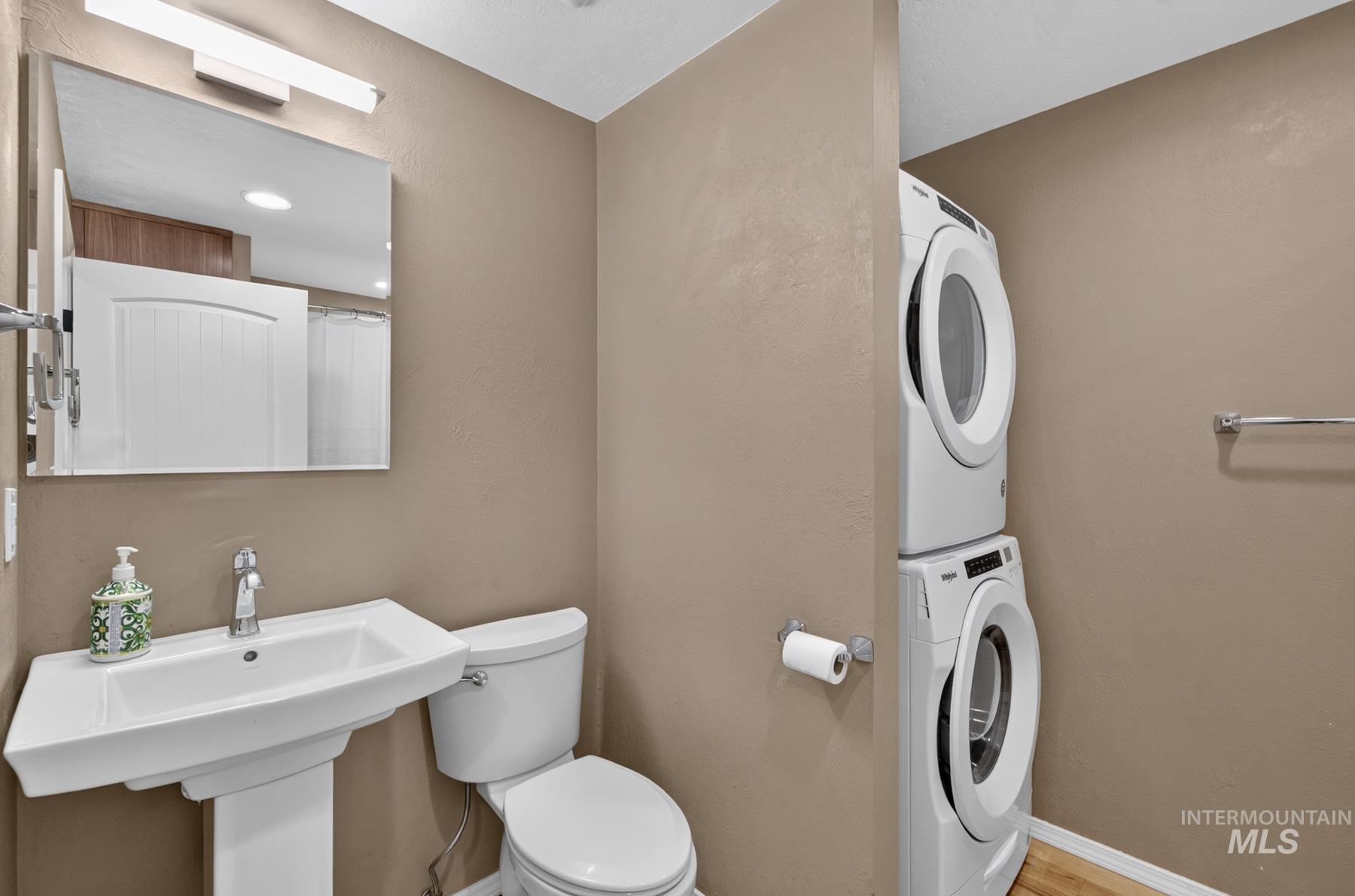 9622 Delaware Street Boise, ID 83709 - Photo 25 of 48 Pedestal sink with chrome faucet and rectangular mirror