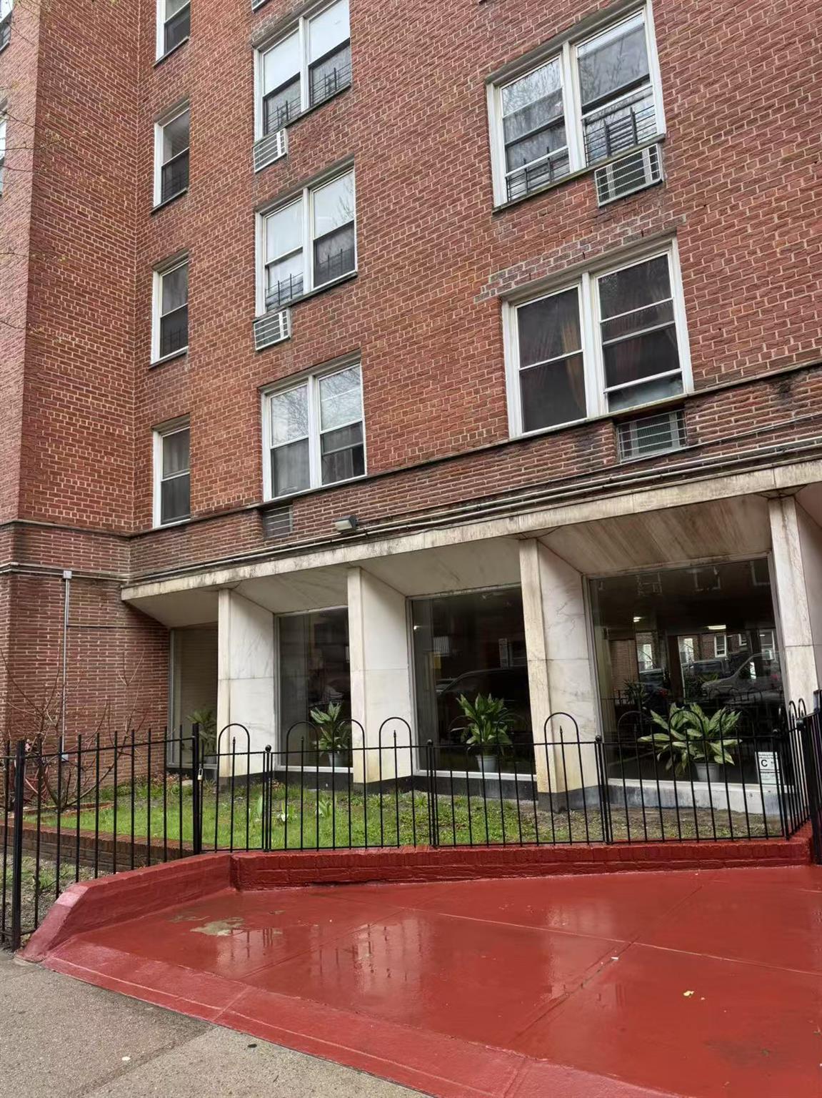 41-67 Judge Street, Unit 4J Queens, NY 11373 - Photo 1 of 9 a view of a building with a porch