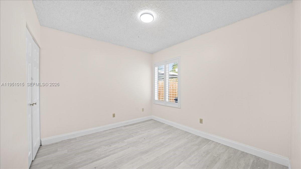 9798 Southwest 147th Place Miami, FL 33196 - Photo 12 of 17 an empty room with a window