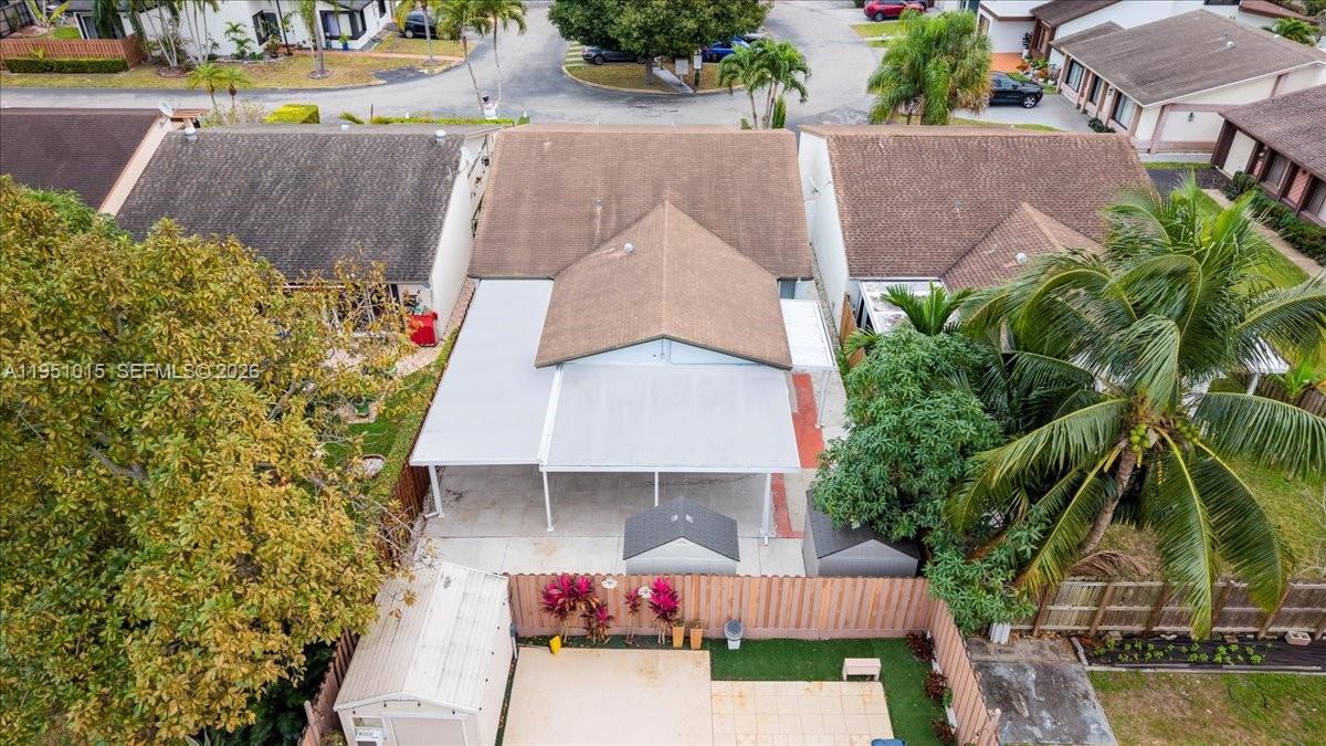 9798 Southwest 147th Place Miami, FL 33196 - Photo 16 of 17 an aerial view of a house with swimming pool and patio