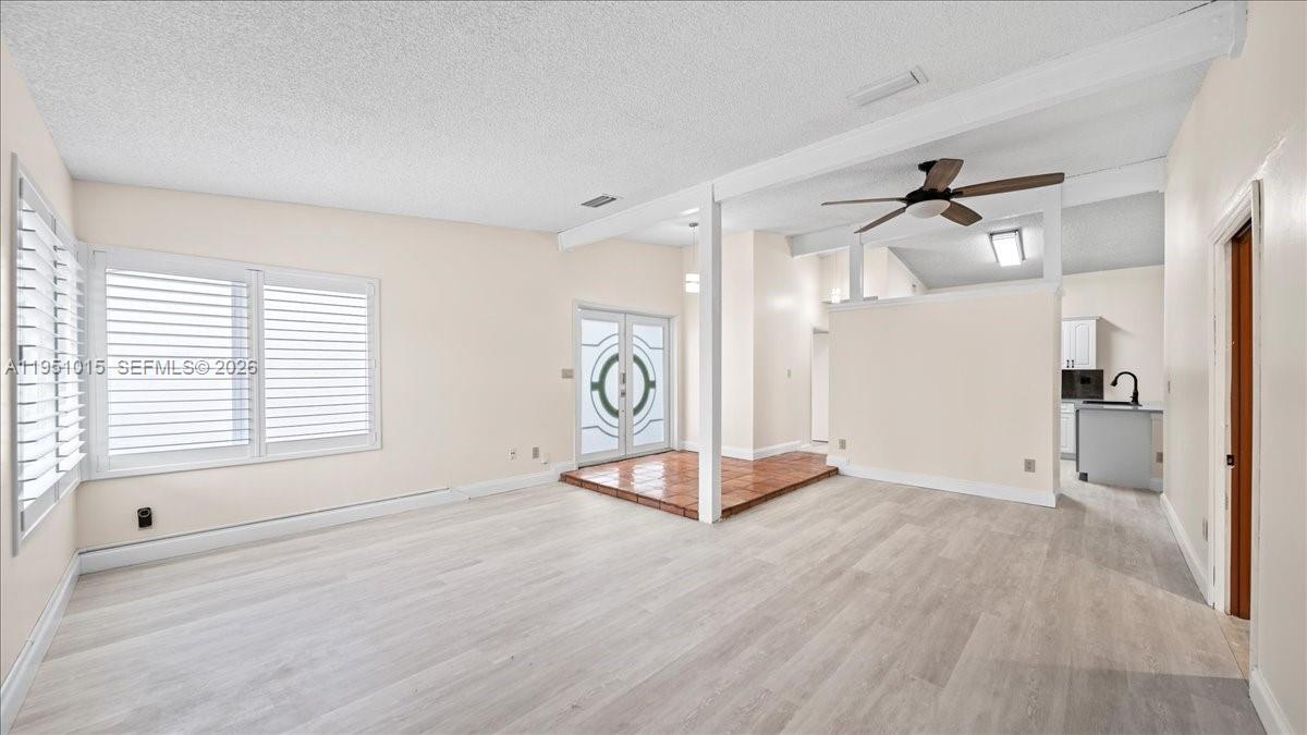 9798 Southwest 147th Place Miami, FL 33196 - Photo 3 of 17 a view of an empty room with a window