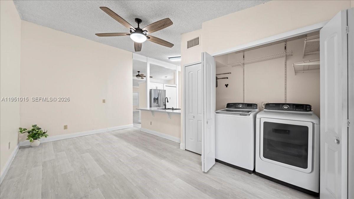 9798 Southwest 147th Place Miami, FL 33196 - Photo 6 of 17 a view of kitchen and utility room