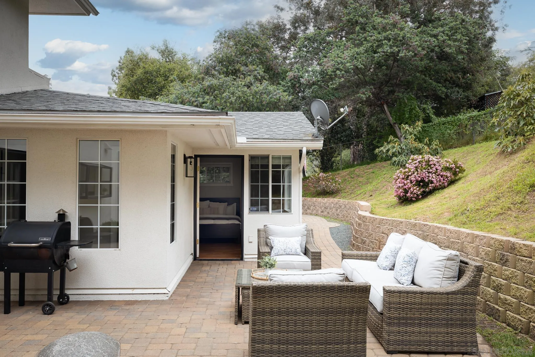 13631 Willow Run Road Poway, CA 92064 - Photo 24 of 51 a view of a patio with couches chairs and potted plants