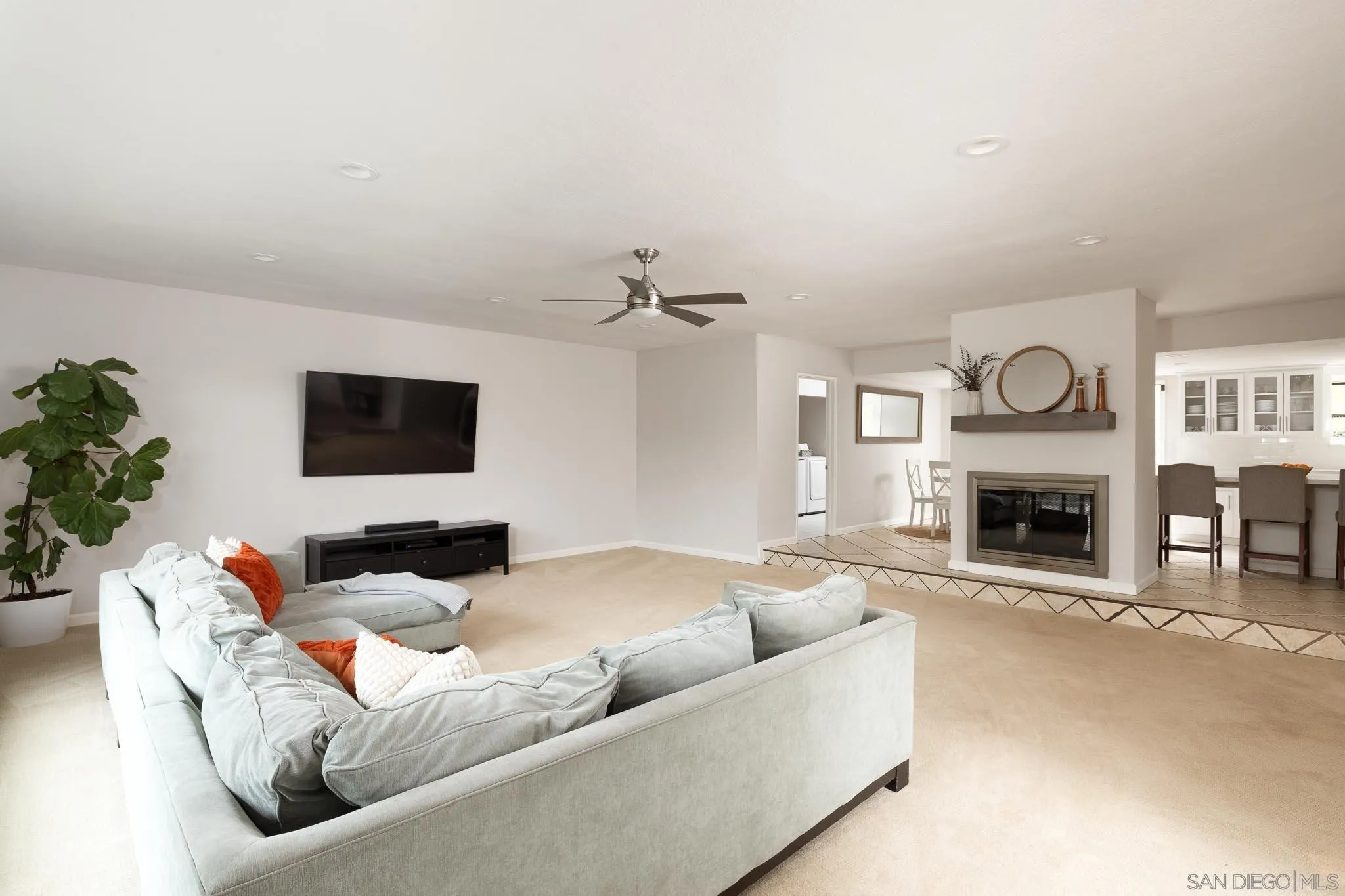 13631 Willow Run Road Poway, CA 92064 - Photo 3 of 51 a living room with furniture a fireplace and a flat screen tv