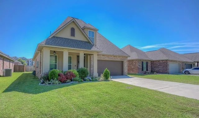 a front view of a house with garden