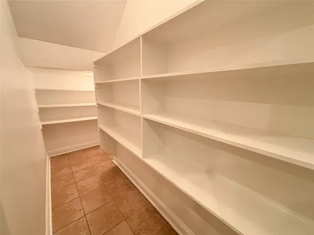 a hallway with a wooden cabinets