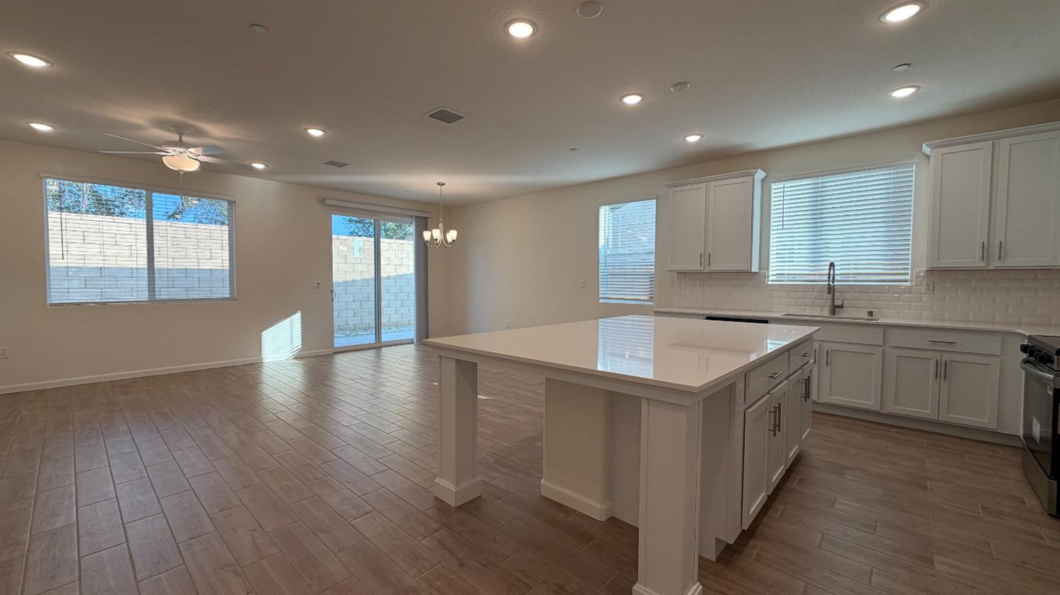 a kitchen with a sink stove and cabinets