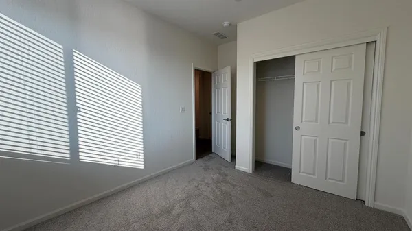 an empty room that has a window in it