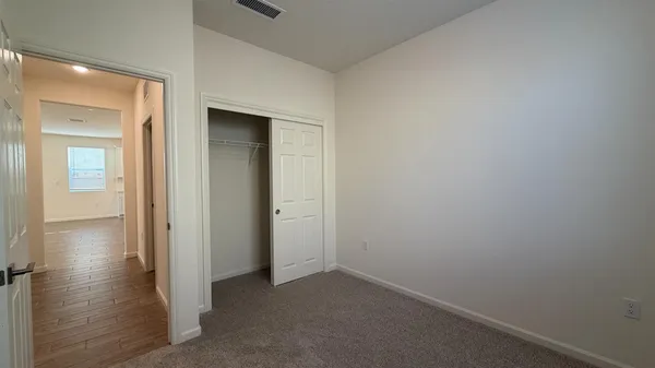 an empty room and wooden door
