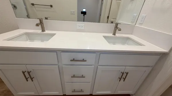 a bathroom with a sink and vanity
