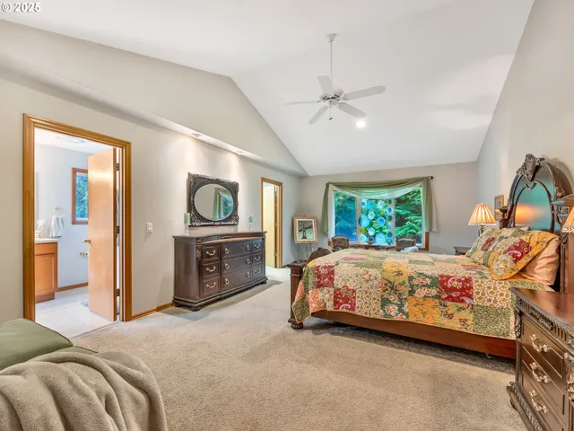 a bed room with a bed and a tv