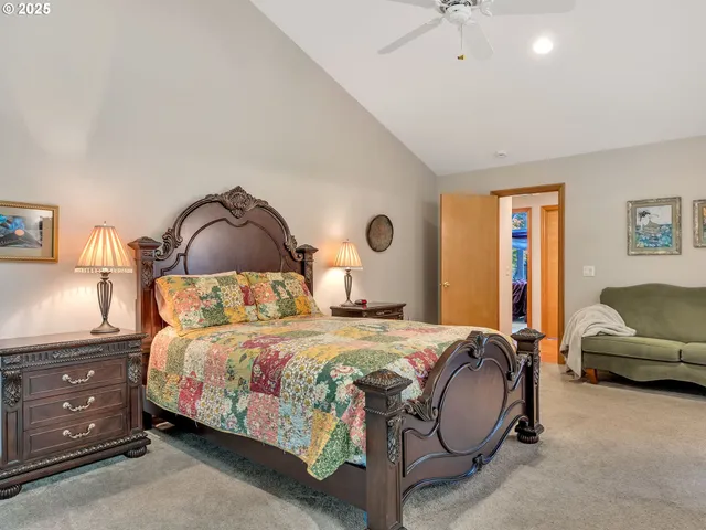 a bedroom with a bed and a couch