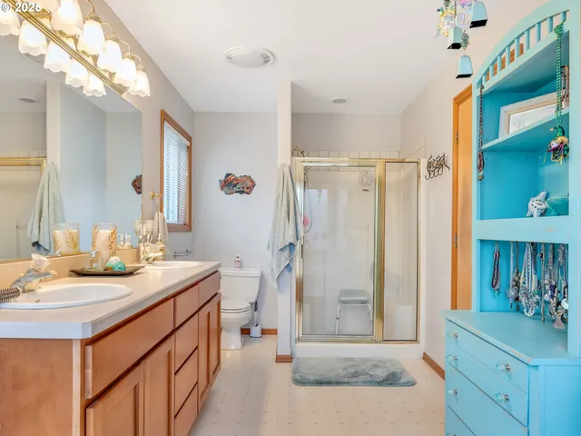 a bathroom with a sink a mirror and a shower