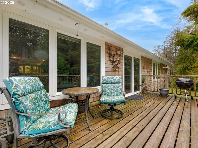 a view of a house with lounge chairs in patio