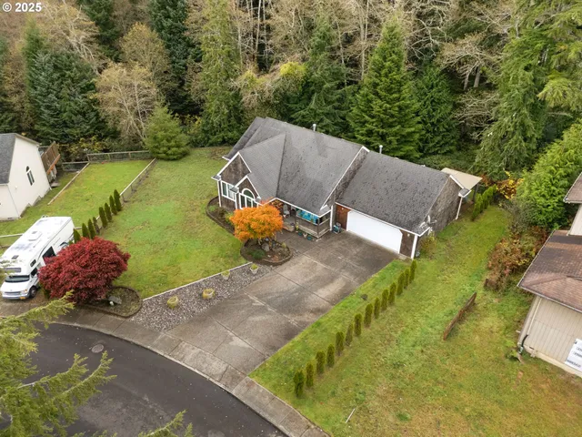 an aerial view of a house with outdoor space