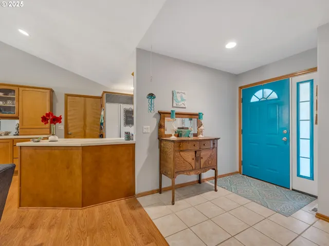 a living room with furniture a flat screen tv and a table
